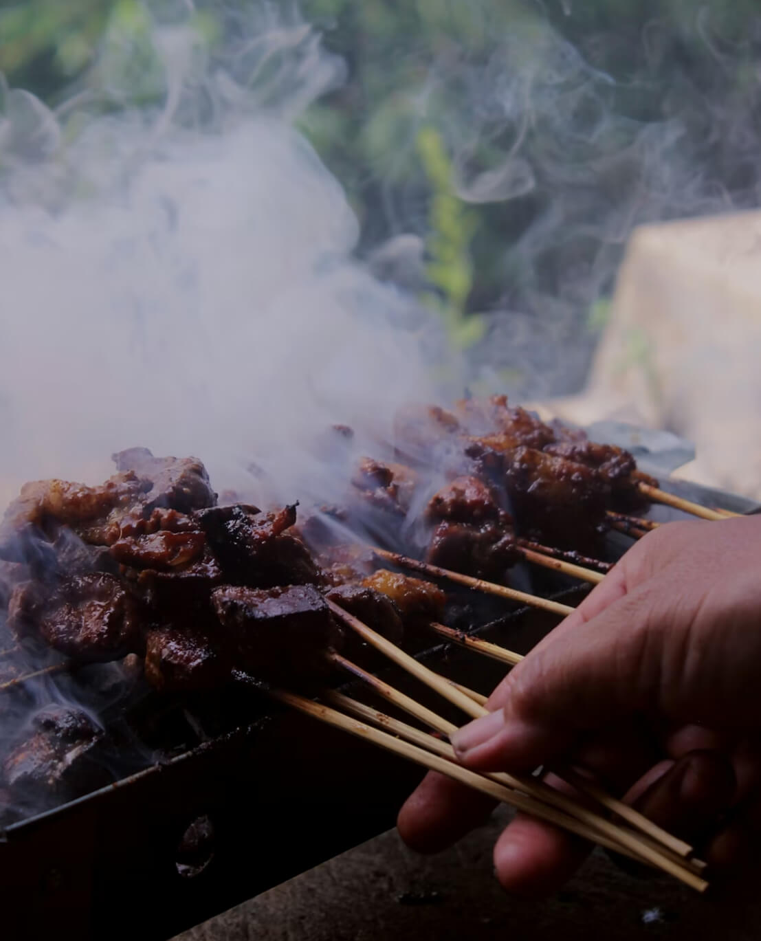 Rich beef rendang with green chillies wrapped in banana leaf